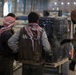 Coalition Forces members distribute pallets of medical supplies to SDF, local doctors