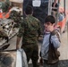 Coalition Forces members distribute pallets of medical supplies to SDF, local doctors