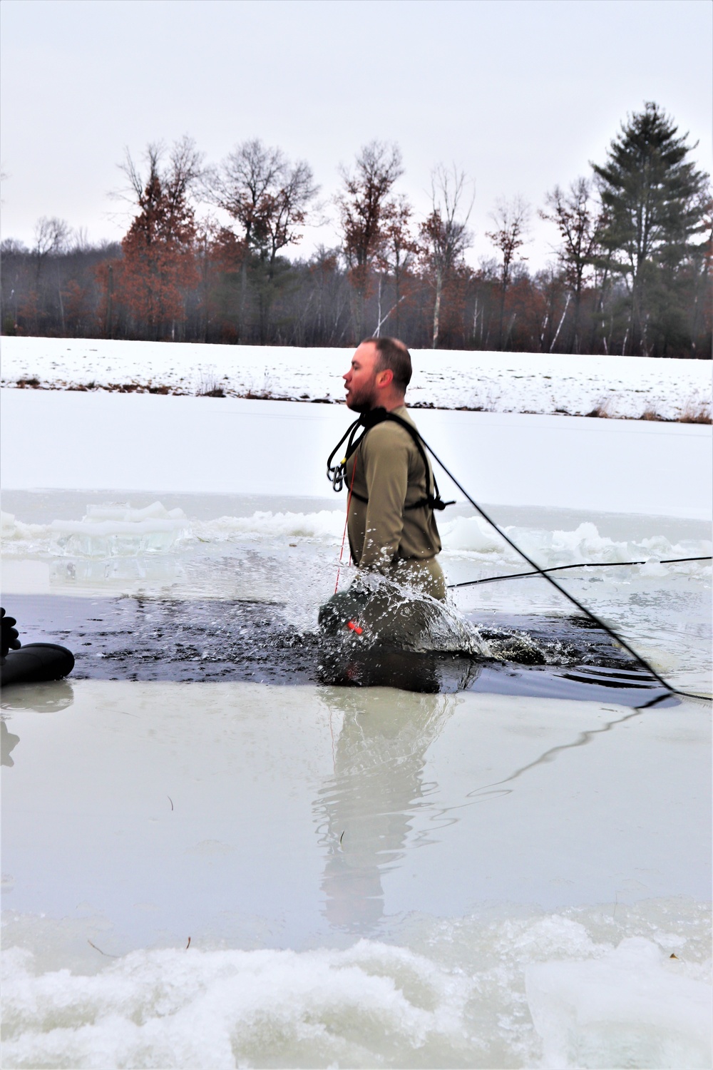 Students participate in cold-water immersion training for CWOC Class 19-01 at Fort McCoy