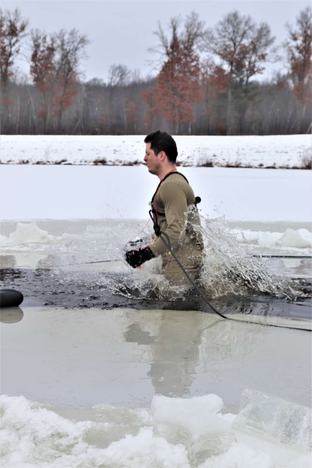 Students participate in cold-water immersion training for CWOC Class 19-01 at Fort McCoy