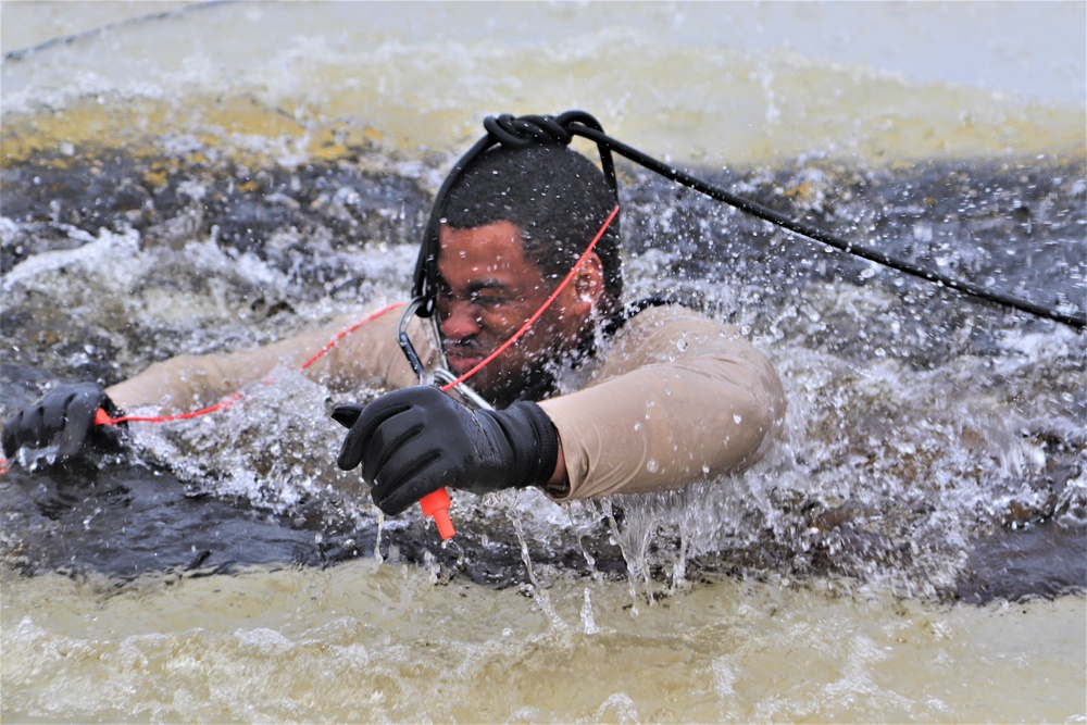 Students participate in cold-water immersion training for CWOC Class 19-01 at Fort McCoy