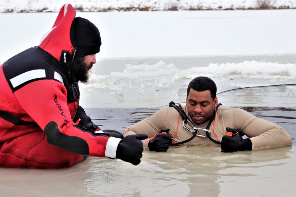 Students participate in cold-water immersion training for CWOC Class 19-01 at Fort McCoy