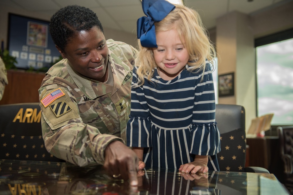 Military child explores Missouri while having ice cream with mayors