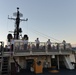 Past and present Coast Guard Cutter Sherman crewmembers honor the cutter’s final colors