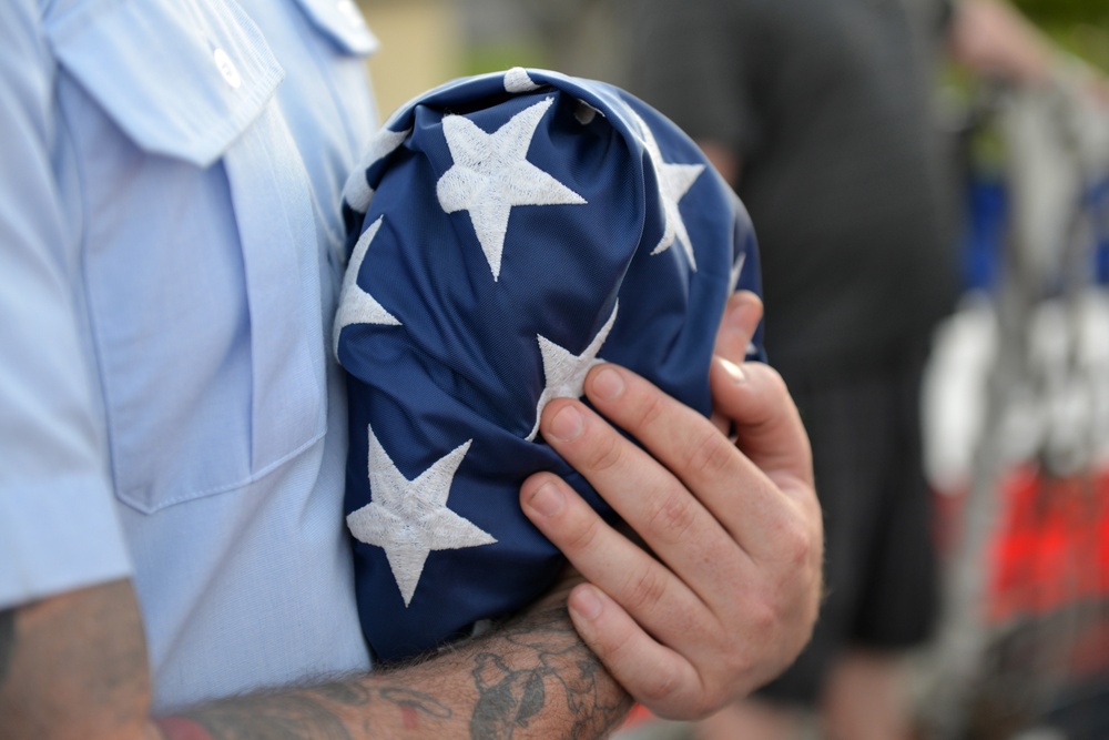 Past and present Coast Guard Cutter Sherman crewmembers honor the cutter’s final colors