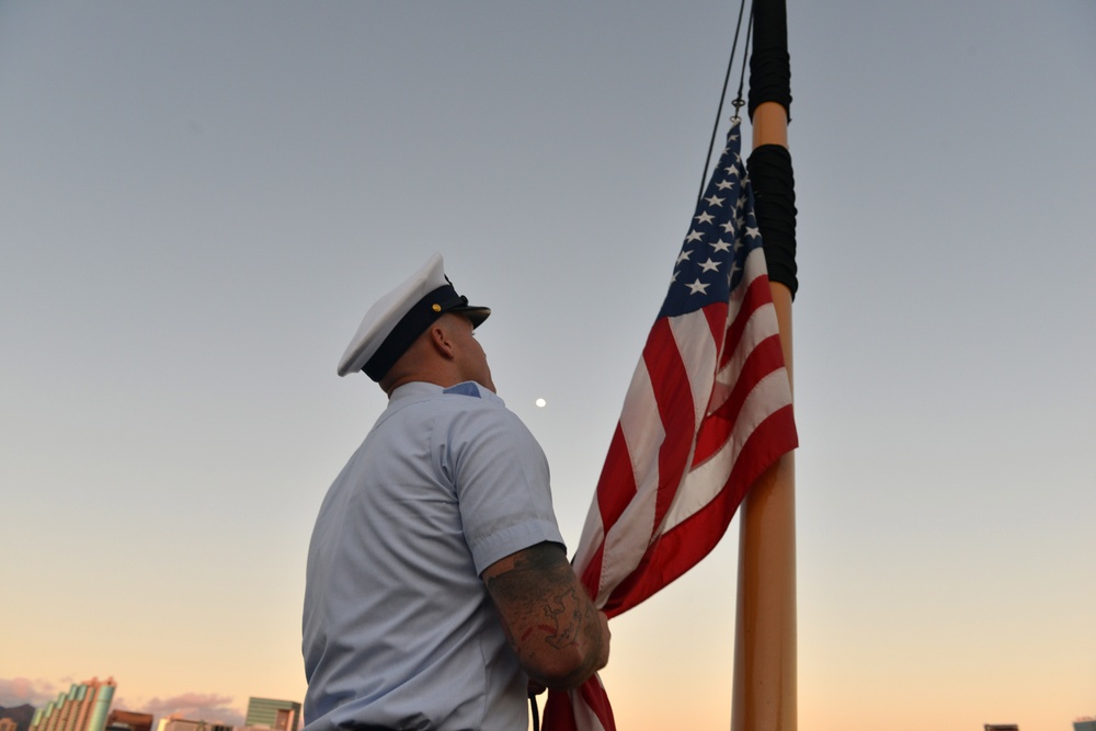 Past and present Coast Guard Cutter Sherman crewmembers honor the cutter’s final colors