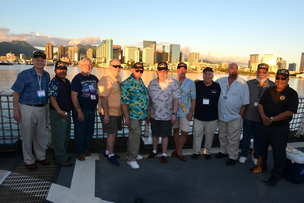 Past and present Coast Guard Cutter Sherman crewmembers honor the cutter’s final colors