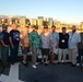 Past and present Coast Guard Cutter Sherman crewmembers honor the cutter’s final colors