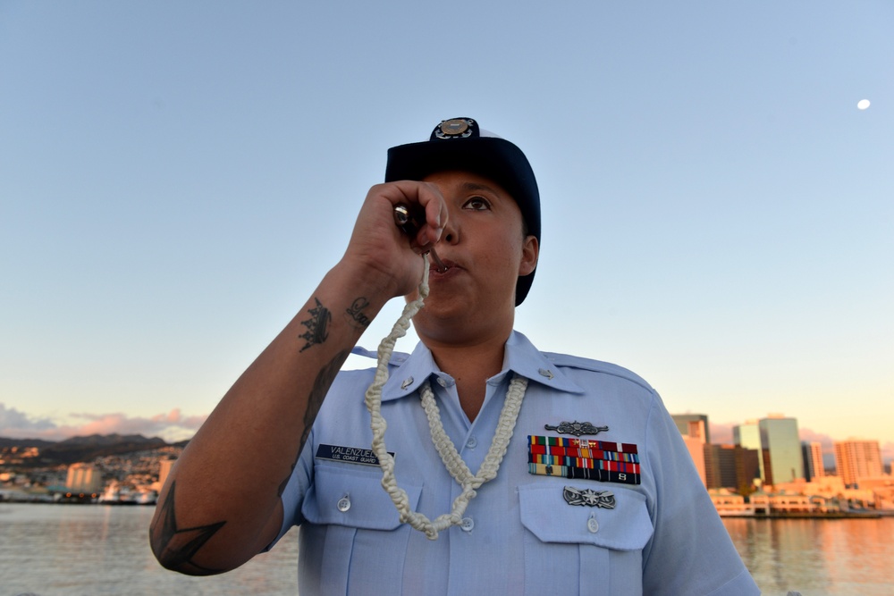 Past and present Coast Guard Cutter Sherman crewmembers honor the cutter’s final colors