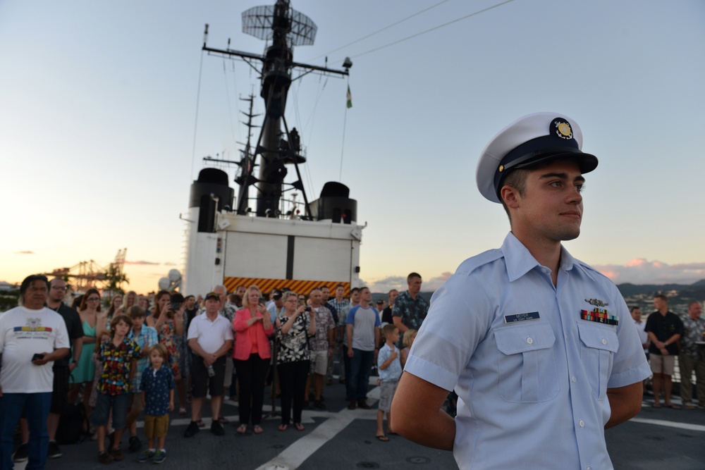 Past and present Coast Guard Cutter Sherman crewmembers honor the cutter’s final colors