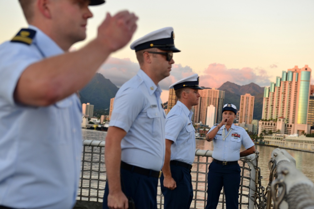 Past and present Coast Guard Cutter Sherman crewmembers honor the cutter’s final colors