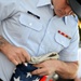 Past and present Coast Guard Cutter Sherman crewmembers honor the cutter’s final colors