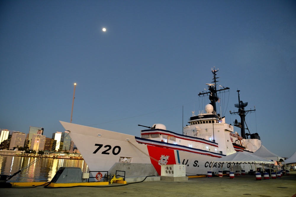 Past and present Coast Guard Cutter Sherman crewmembers honor the cutter’s final colors