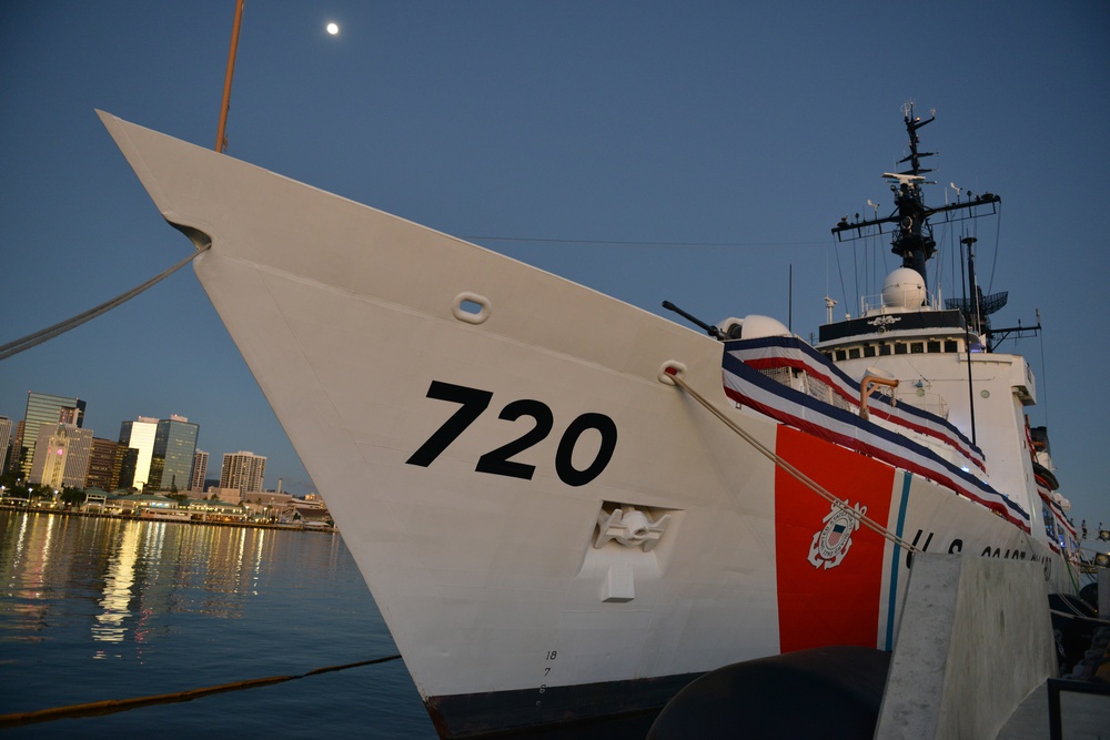 Past and present Coast Guard Cutter Sherman crewmembers honor the cutter’s final colors