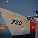 Past and present Coast Guard Cutter Sherman crewmembers honor the cutter’s final colors