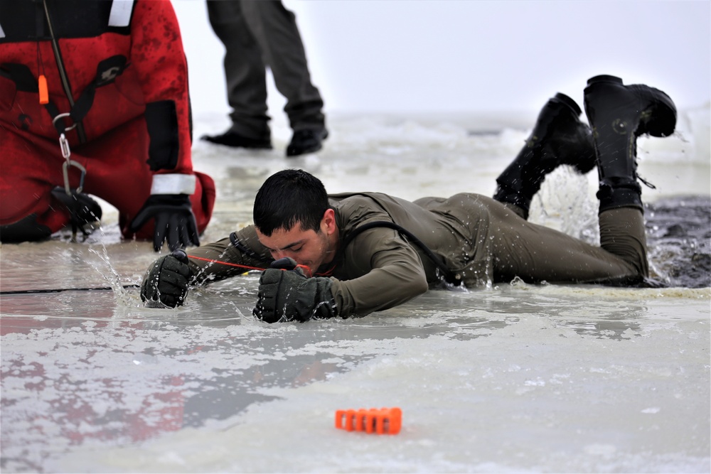 Students participate in cold-water immersion training for CWOC Class 19-01 at Fort McCoy