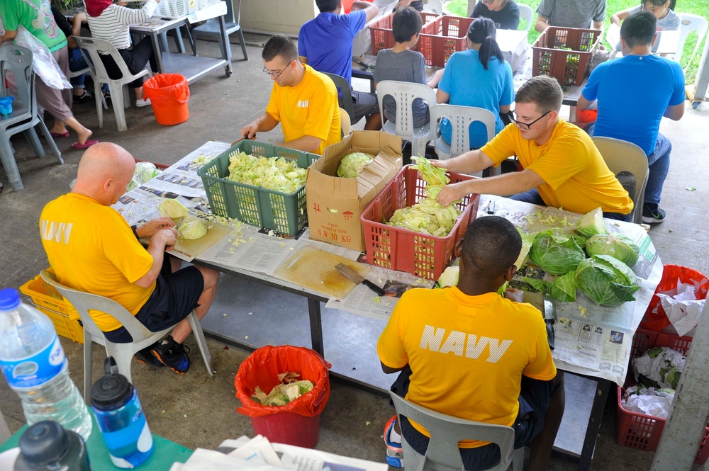 Emory S. Land Sailors volunteer at Singapore Soup Kitchen