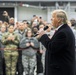President Donald Trump and first lady Melania Trump pose for a photo with U.S. Airmen on Ramstein Air Base, Germany