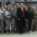 President Donald Trump and first lady Melania Trump pose for a photo with U.S. Airmen on Ramstein Air Base, Germany