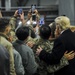 President Donald Trump and first lady Melania Trump pose for photos with U.S. Airmen on Ramstein Air Base, Germany