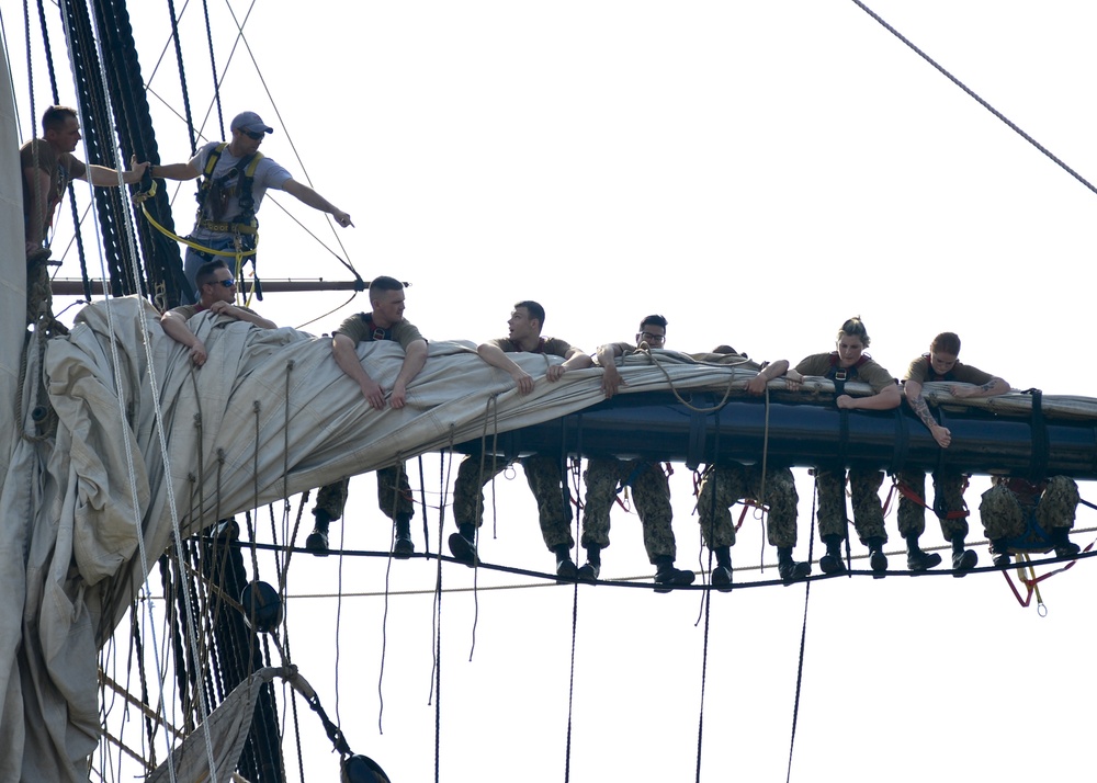Constitution CO and Sailors Furl 'Old Ironsides' Main Topsail