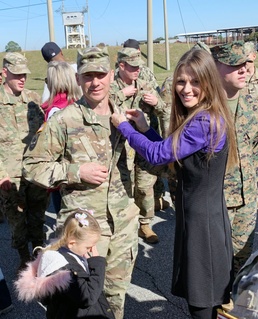 Sergeant major receives wings from spouse