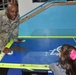 Soldier teach girls about winning