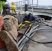 USACE Black Rock Lock employees position themselves to conduct repairs