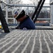 USACE Black Rock Lock employee works below walkway