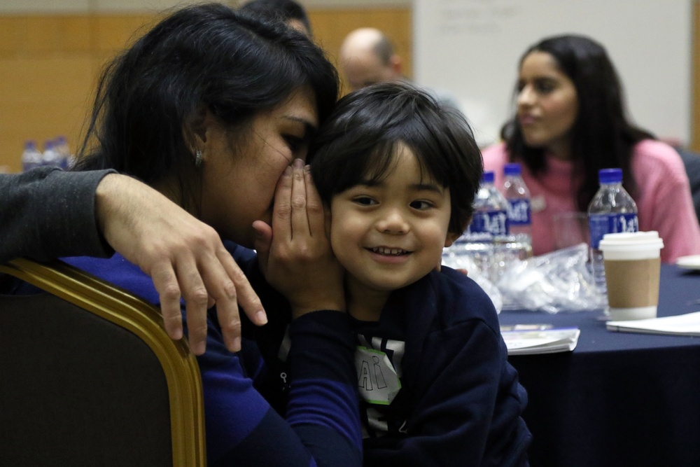 Mother, child share a moment during a relationship-enhancement training event