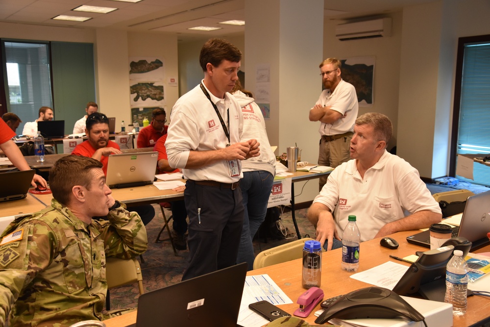 U.S. Virgin Islands RFO staff talk with  Emergency Support Function 3 team leader