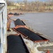 Barges pinned against McAlpine Dam on Ohio River