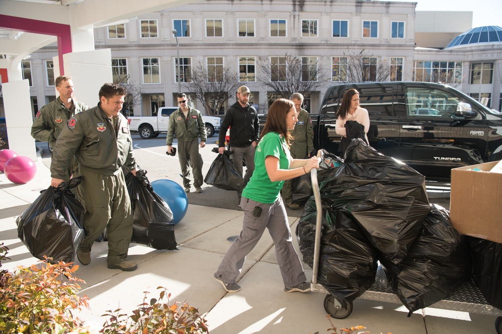 149th Fighter Squadron partners with community to donate toys to Children's Hospital