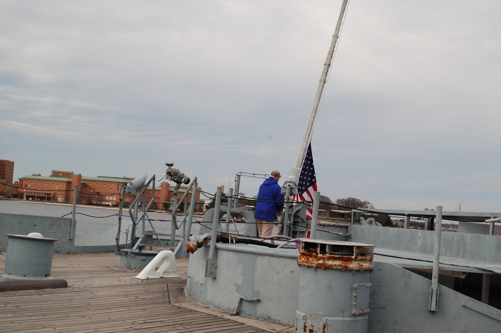 Raising the National Ensign on a Battleship