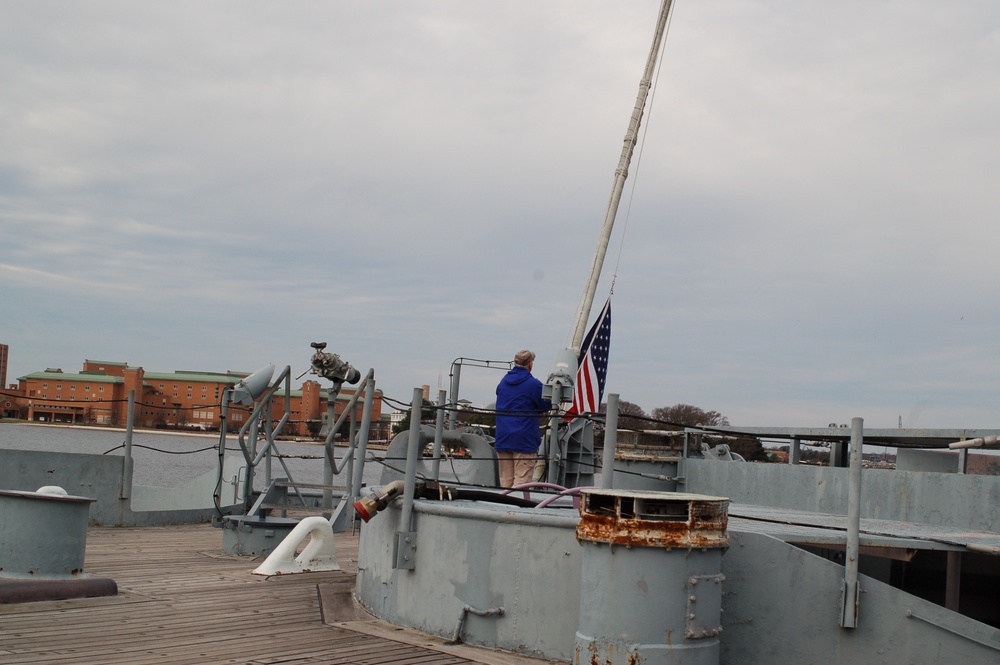 Raising the National Ensign on a Battleship