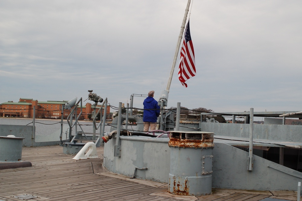 Raising the National Ensign on a Battleship