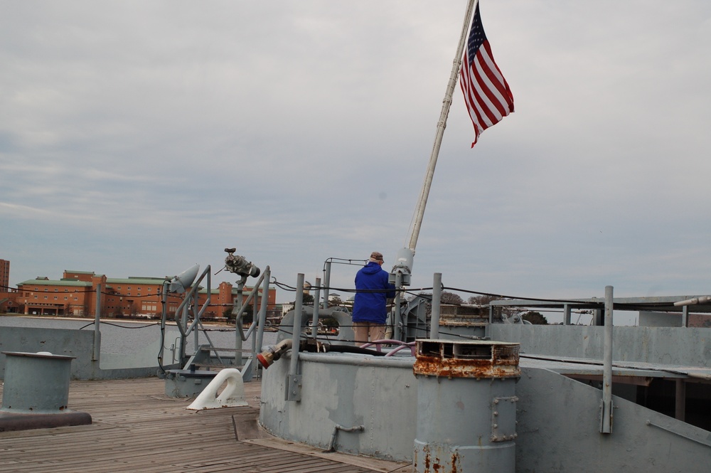 Raising the National Ensign on a Battleship