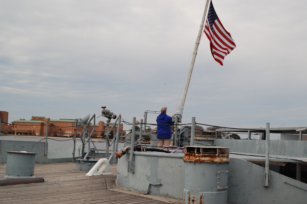 Raising the National Ensign on a Battleship