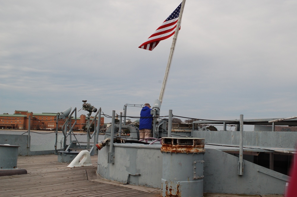 Raising the National Ensign aboard a Battleship