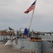 Raising the National Ensign aboard a Battleship