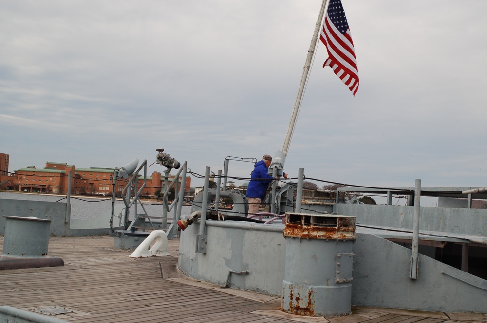 Raising the National Ensign aboard a Battleship