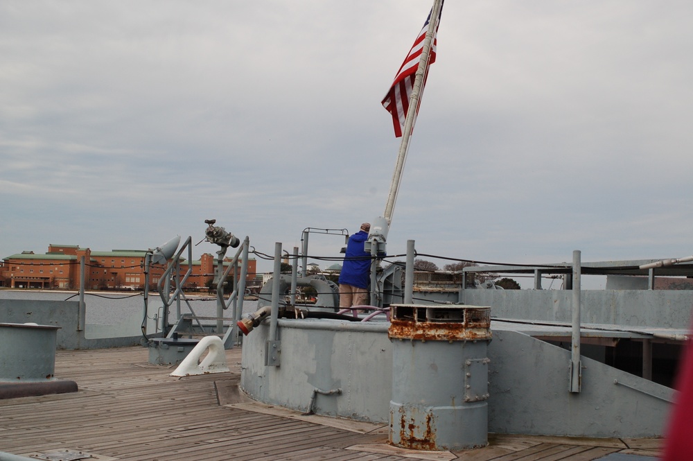 Raising the National Ensign aboard a Battleship