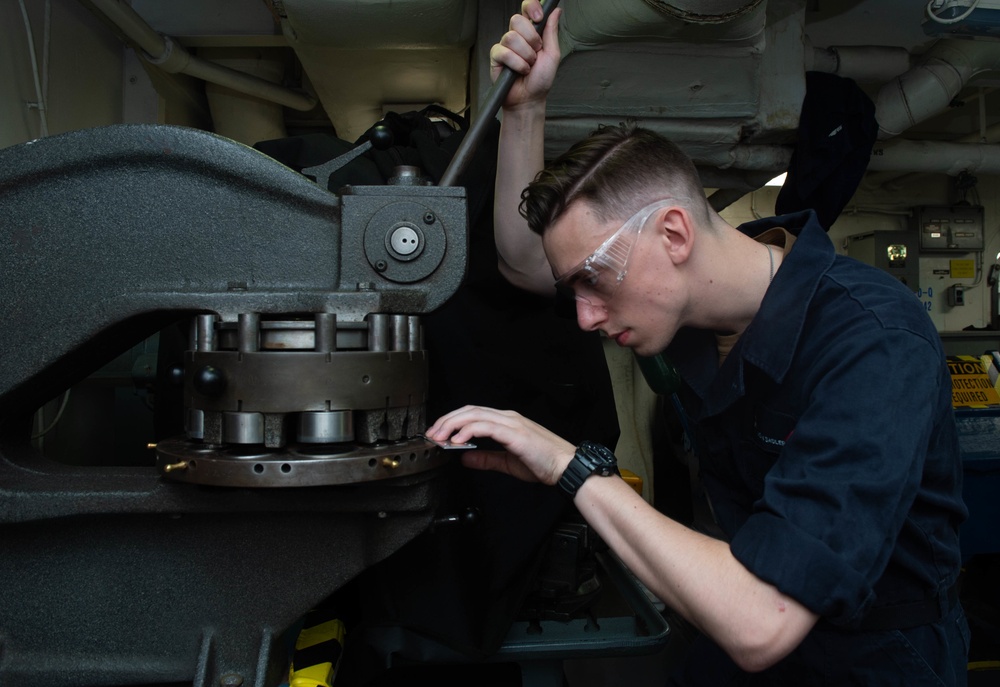 U.S. Sailor uses a turret punch