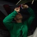 U.S. Sailor strips sealant aboard the aircraft carrier USS John C. Stennis (CVN 74)