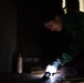 U.S. Sailor removes corrosion aboard the aircraft carrier USS John C. Stennis (CVN 74)