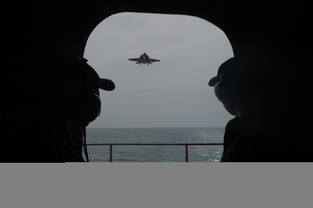 U.S. Sailors observe flight operations