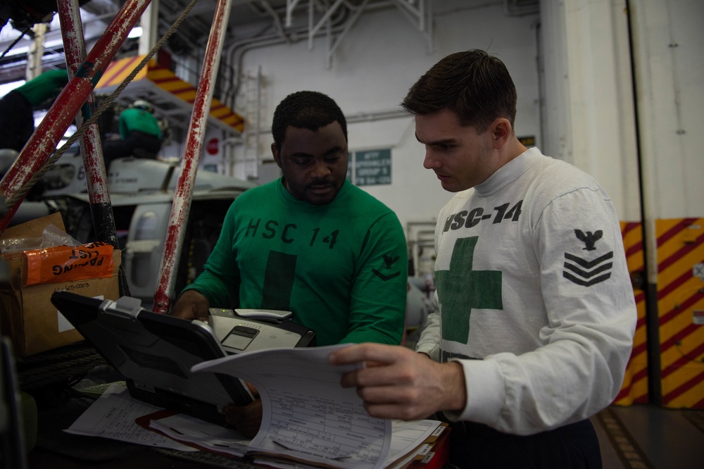 U.S. Sailors review inspection criteria aboard the aircraft carrier USS John C. Stennis (CVN 74)