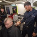 U.S. Sailor cuts commanding officer's hair