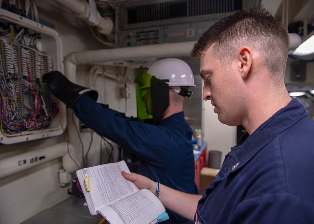 U.S. Sailor conducts initial voltage verification training