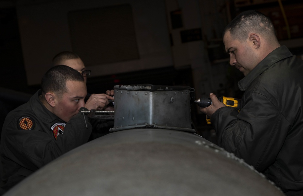 Airframes mechanics prepare external fuel tank for flight